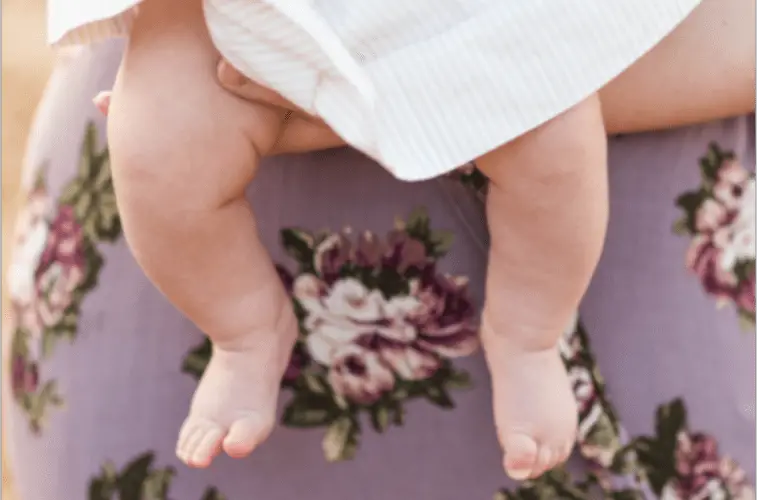 Holding Baby Legs Elimination COmmunication