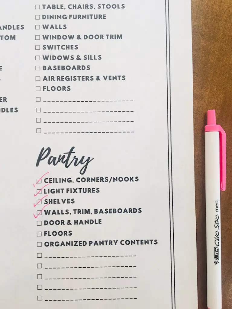 checklist for pantry spring cleaning with pink pen 