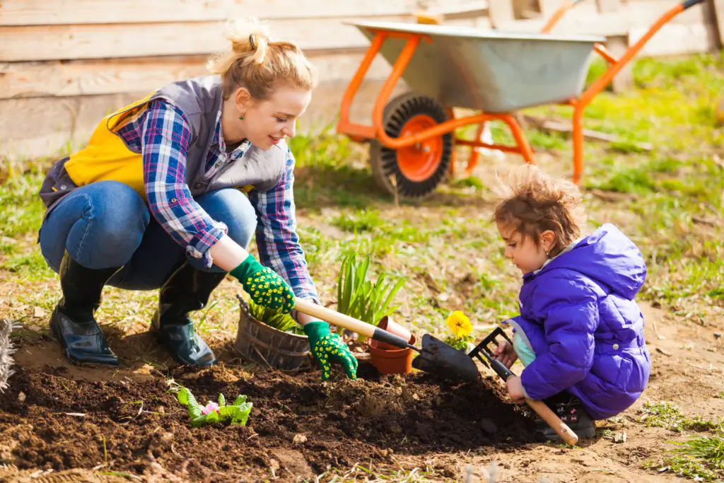 mother and child gardening how to raise healthy kids
