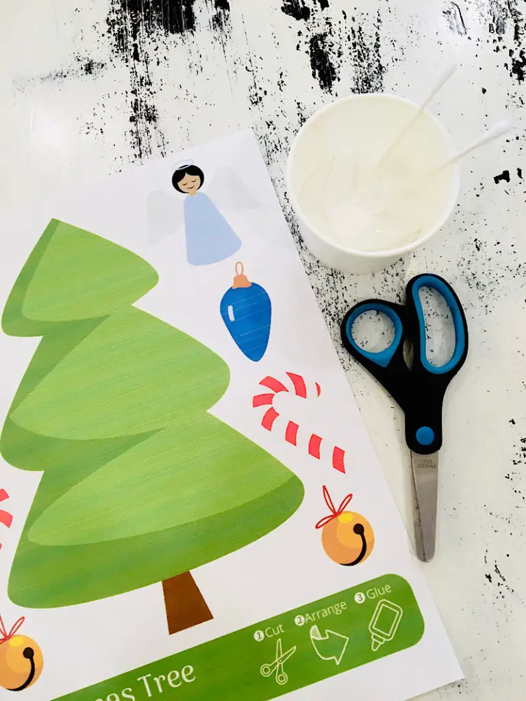scissors, glue, and printable craft on a table